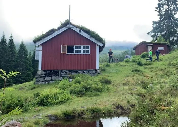 Historic Log House At The Foot Of Middagstind