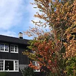 Historic Log House At The Foot Of Middagstind *